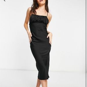 Black slip dress with ruched breast and tie back